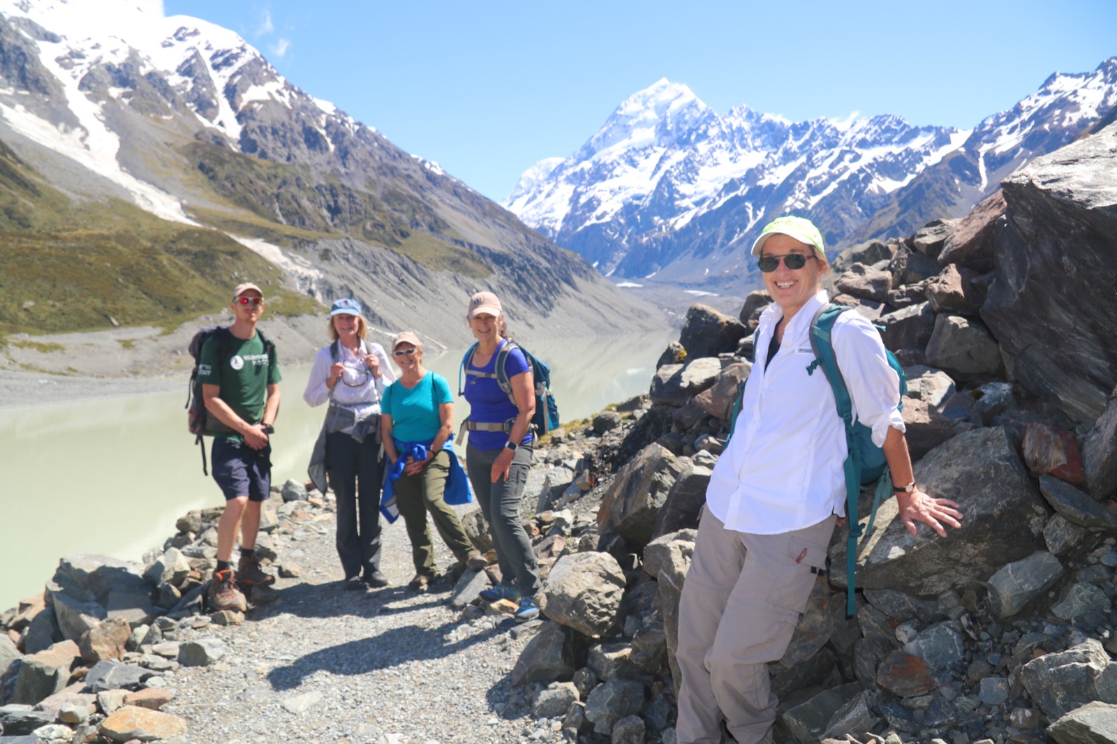 Posing for a photo in New Zealand after a long hike